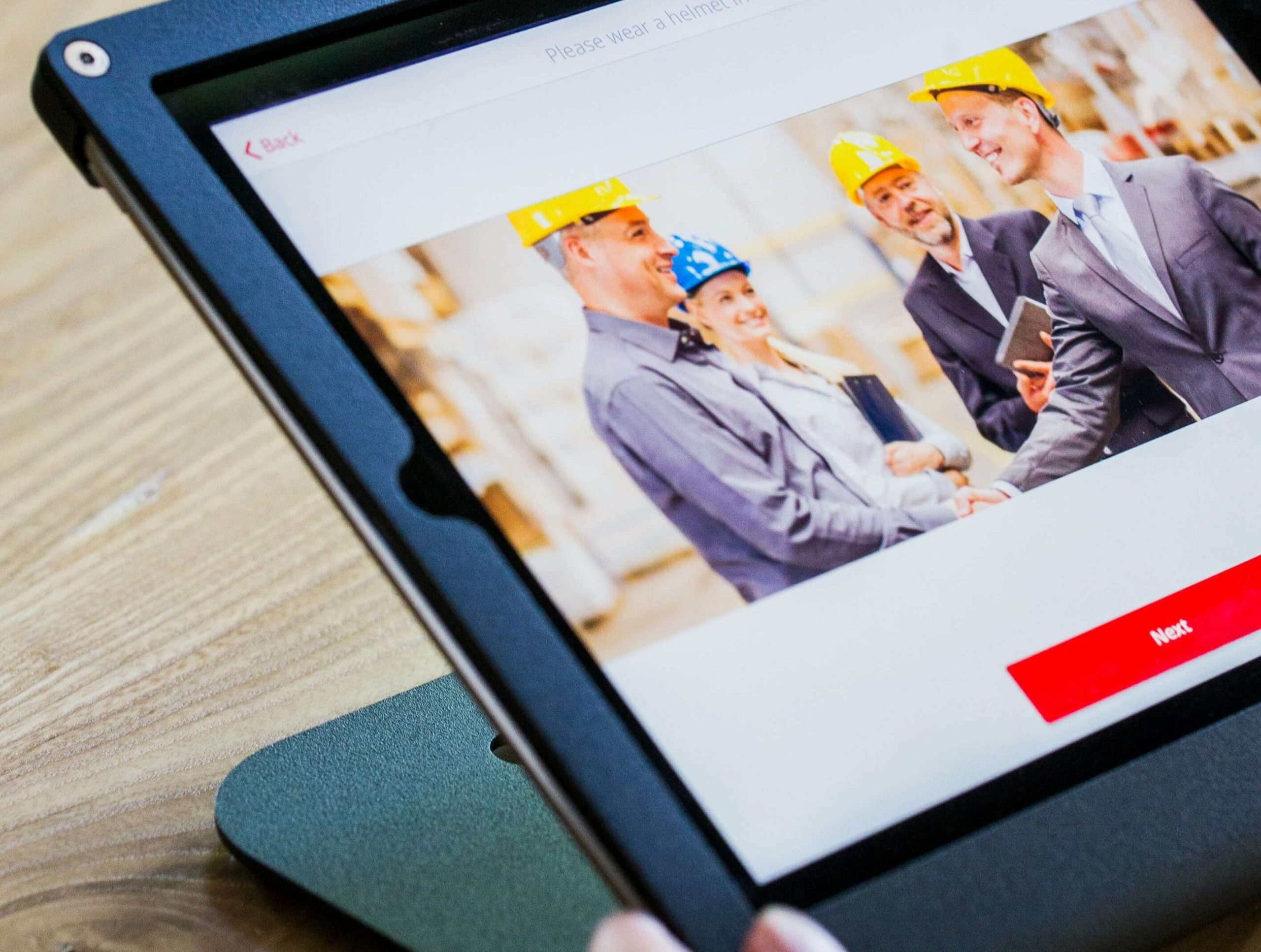 Someone watching a safety compliance video on a tablet